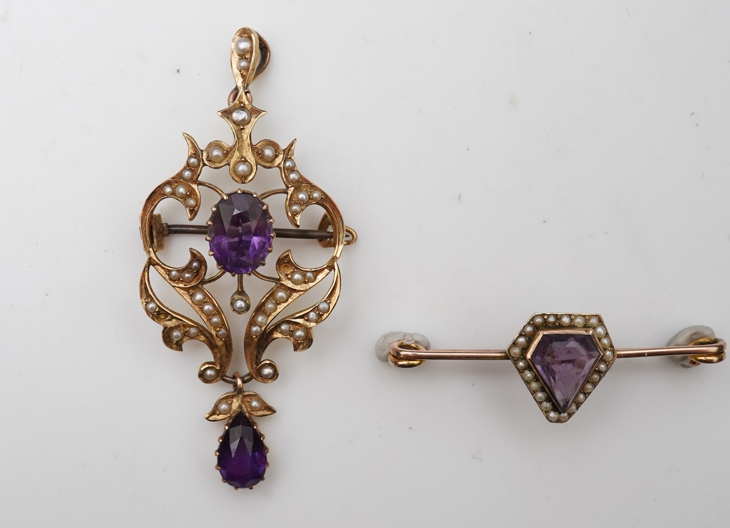 An Edwardian amethyst and seed pearl pendant and bar brooch, early 20th century